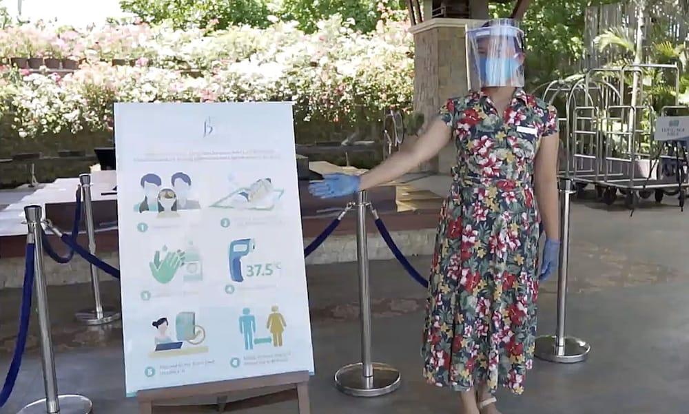 The Bellevue Resort Panglao Exteriör bild A woman wearing a face shield at the entrance of a hotel in Paris, France